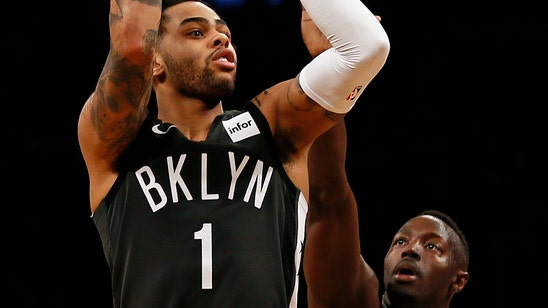 Russell’s double-double helps Nets edge Magic 114-110