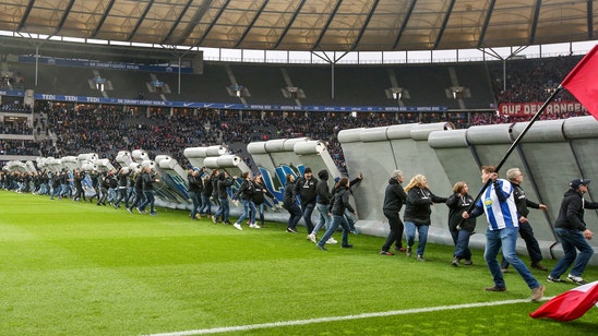 Soccer fans tear down 'Berlin Wall' at Hertha-Leipzig game