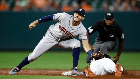 Cole tunes up for playoffs, helps Astros beat Orioles 2-1