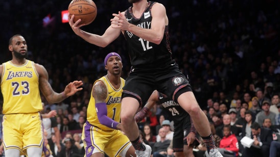 Russell helps Nets hold off Lakers for 6-game winning streak