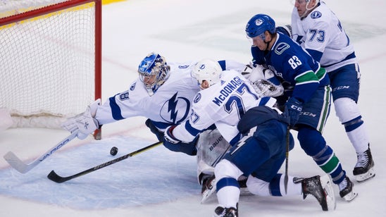 Kucherov, Lightning beat Canucks 5-2 in fight-filled game