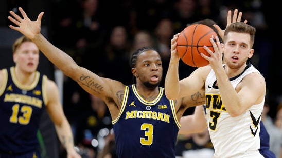 Iowa uses balanced scoring to top No. 5 Michigan 74-59