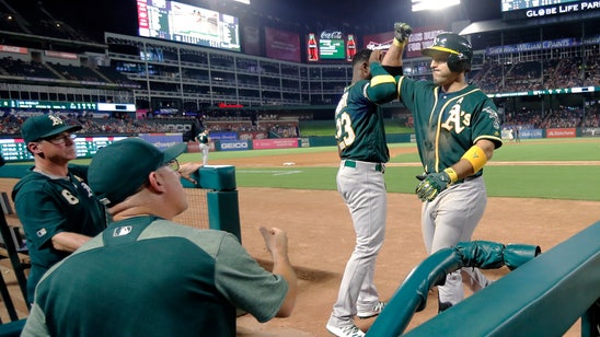 Davis hits 2 HRs, A's top Rangers 14-9, keep wild-card lead