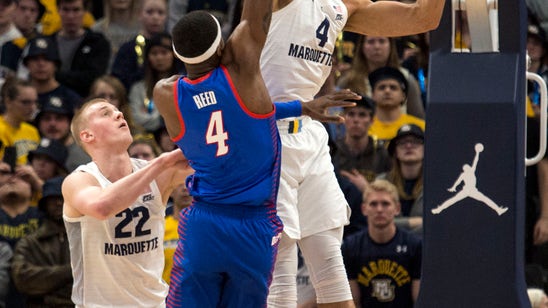 Howard scores 23 as No. 12 Marquette holds off DePaul 79-69