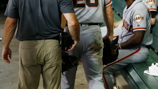 Posey leaves game inning after taking foul ball on mask