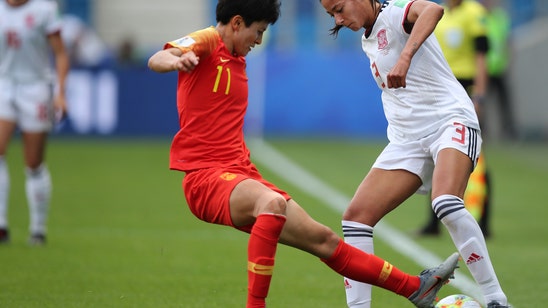 Spain and China advance with scoreless draw