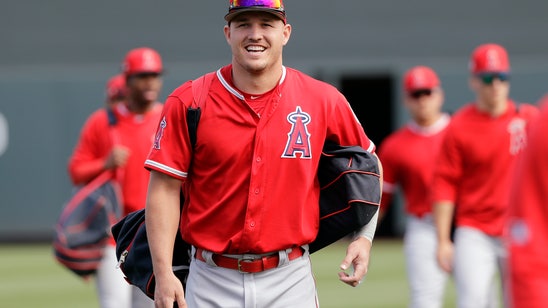 Trout plays full game a day after receiving record contract