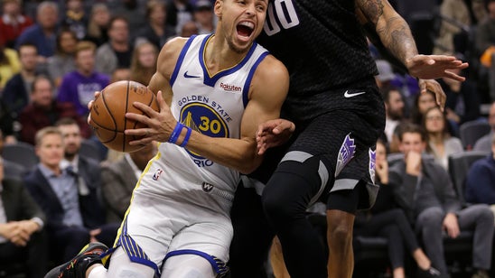 Curry scores 42 points, Warriors hold off Kings 127-123