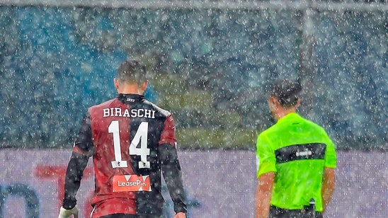 Napoli fights back to beat Genoa 2-1 and stay close to Juve