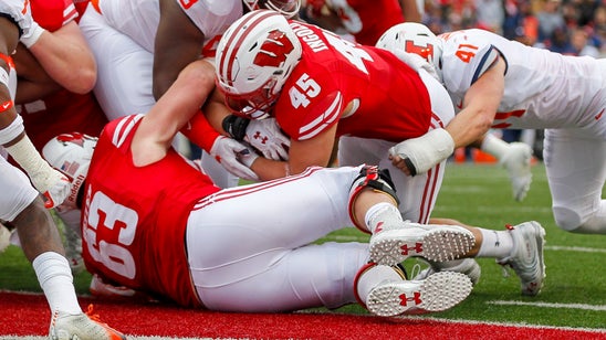 Taylor and Deal carry No. 23 Wisconsin past Illinois 49-20