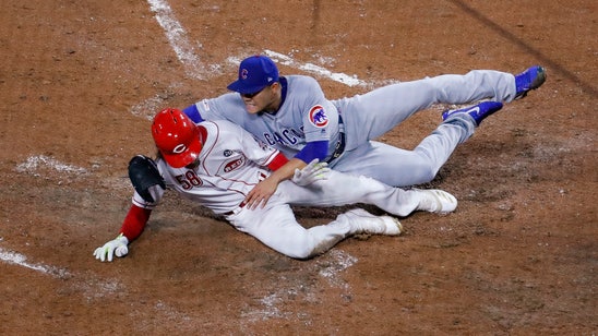 Suarez singles in rain, Reds slow Cubs’ surge with 4-2 win