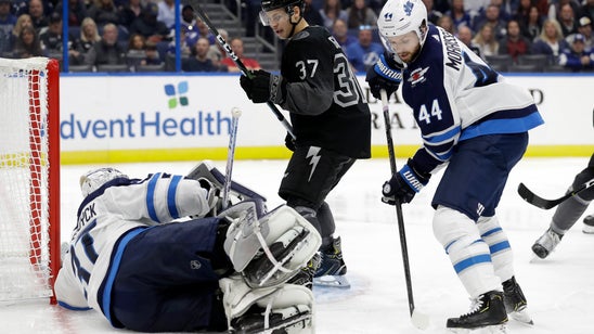 Hellebuyck lifts Jets over TB; Stamkos gets 400th goal