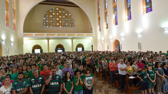 Chapecoense fans gather at stadium and in churches to mourn after tragic plane crash