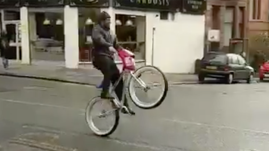 Marshawn Lynch is in Scotland popping wheelies on a BMX bike while playing chicken with a bus
