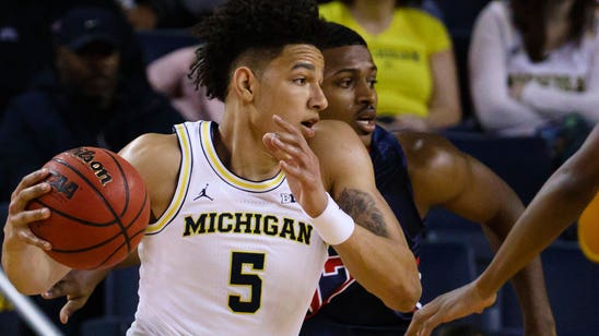 Michigan pulls away in second half to beat Howard 76-58