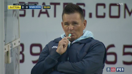 This manager appears to be vaping on the FA Cup sidelines
