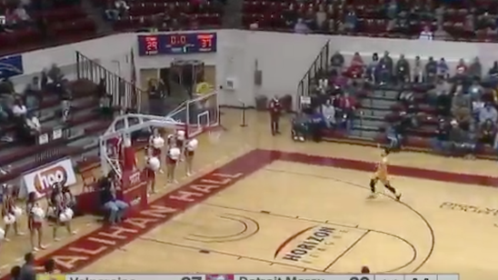 Three-quarter court heave impossibly goes in after hitting top of shot clock