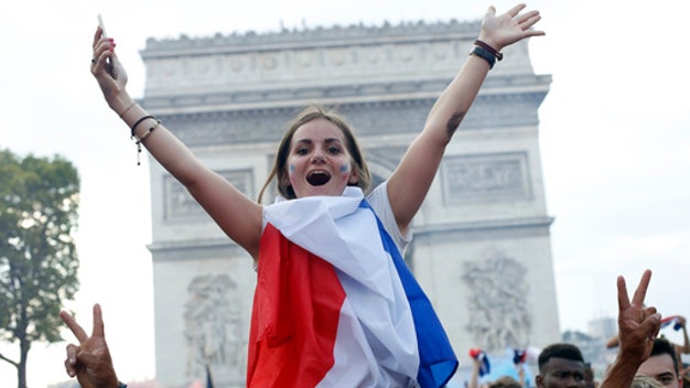 With flags, song, pride, French celebrate World Cup victory