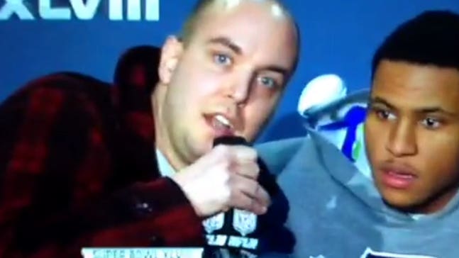 9/11 conspiracy theorist interrupts Malcolm Smith's Super Bowl press conference