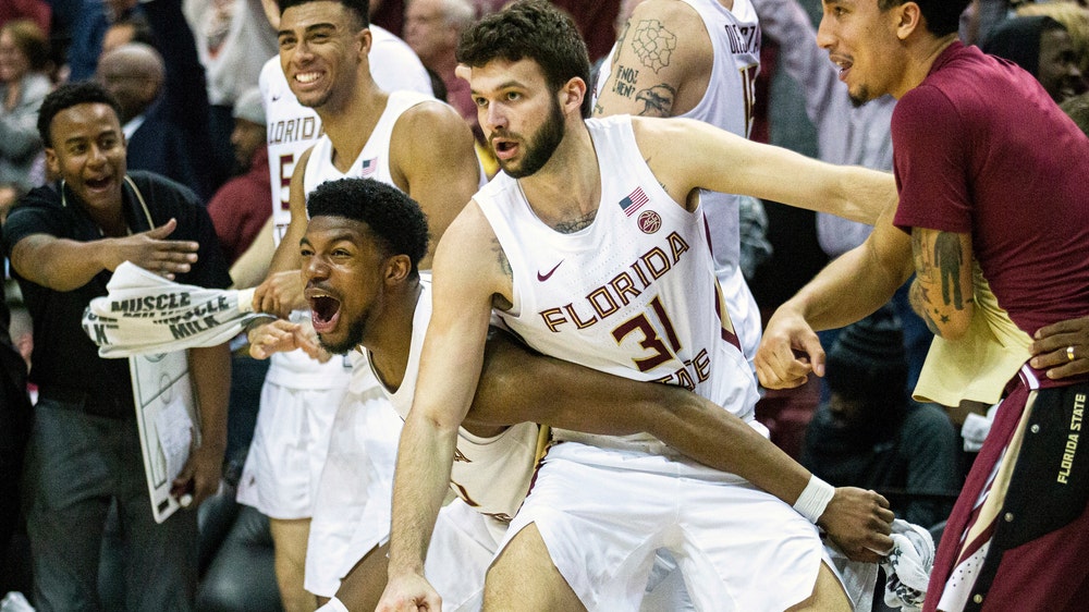 Aubuike, No. 1 Kansas avoid letdown, rout Oklahoma State