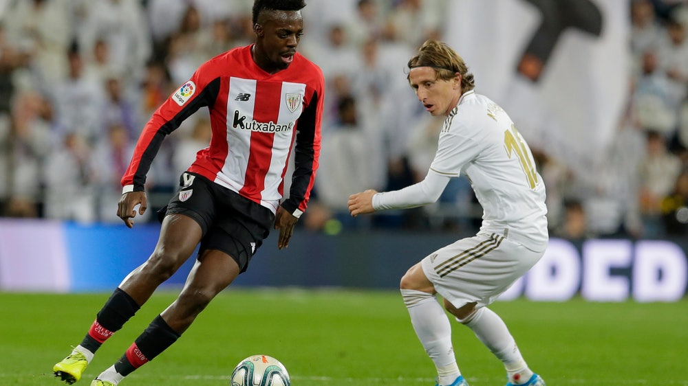 Spanish league president condemns racism, fan street clashes