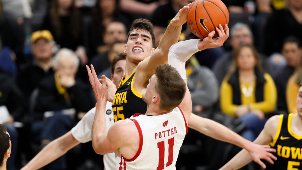 Garza, No. 18 Iowa rally to beat Wisconsin 68-62