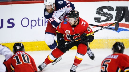 Brodie's goal late in OT lifts Flames past Blue Jackets 3-2