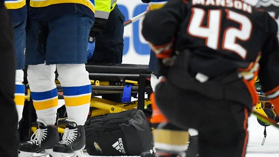 Blues' Bouwmeester remains hospitalized after bench collapse