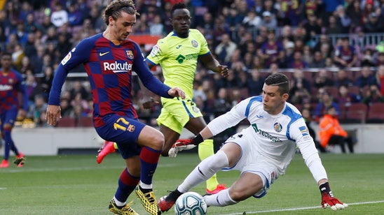 Barcelona salvages 2-1 win over Getafe in Spanish league