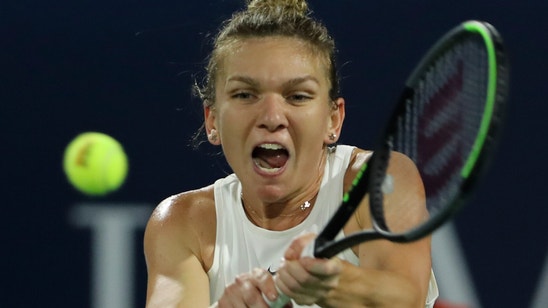 Halep rallies to set up Dubai semifinal against Brady