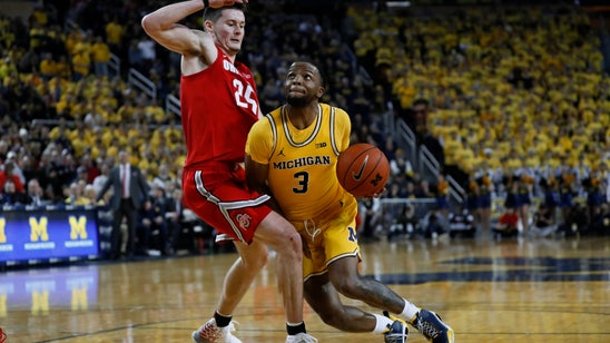 Report: Michigan's Simpson crashed car prior to suspension