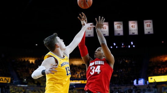 Review in final minute lifts Ohio State past Michigan 61-58
