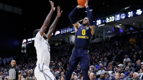 Howard gets hurt, Marquette rallies over Xavier 84-82 in 2OT