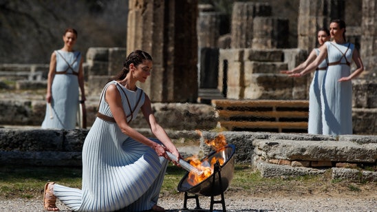 Amid virus precautions, Tokyo Olympic flame is lit in Greece