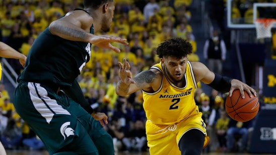 Livers returns, Michigan beats No. 16 Michigan State 77-68