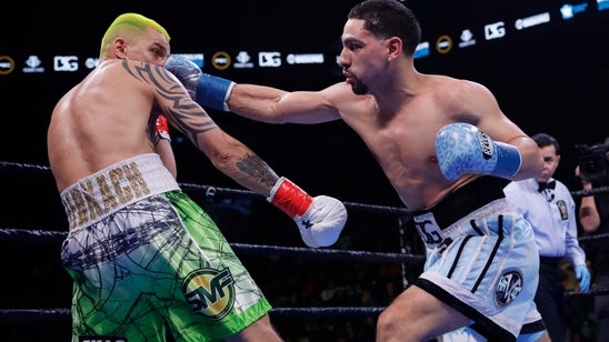 Garcia earns 12-round decision, overcomes bite by Redkach