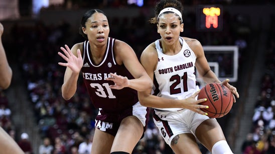 No. 1 Gamecocks win 23rd straight over No. 12 Aggies 60-52