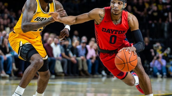 Crutcher scores 18, leads No. 5 Dayton past VCU 66-61
