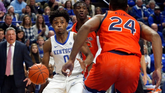 No. 8 Kentucky tops No. 15 Auburn 73-66 to clinch SEC title