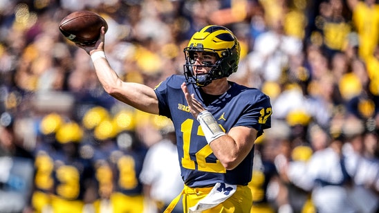 Michigan defense shines as Wolverines QB battle rages on