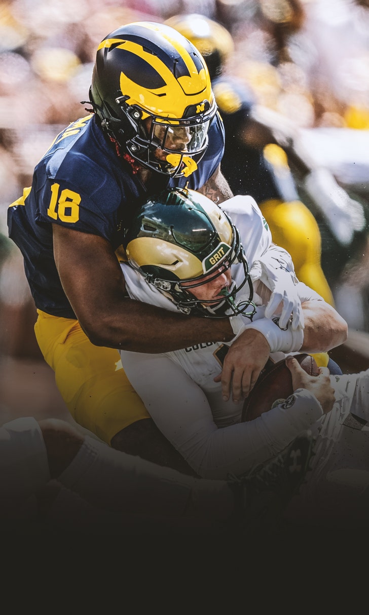Michigan defense shines as Wolverines QB battle rages on