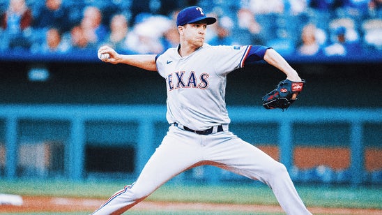 Jacob deGrom exits with wrist injury in Rangers' win over Royals