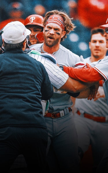 Phillies’ Bryce Harper ejected after charging Rockies dugout