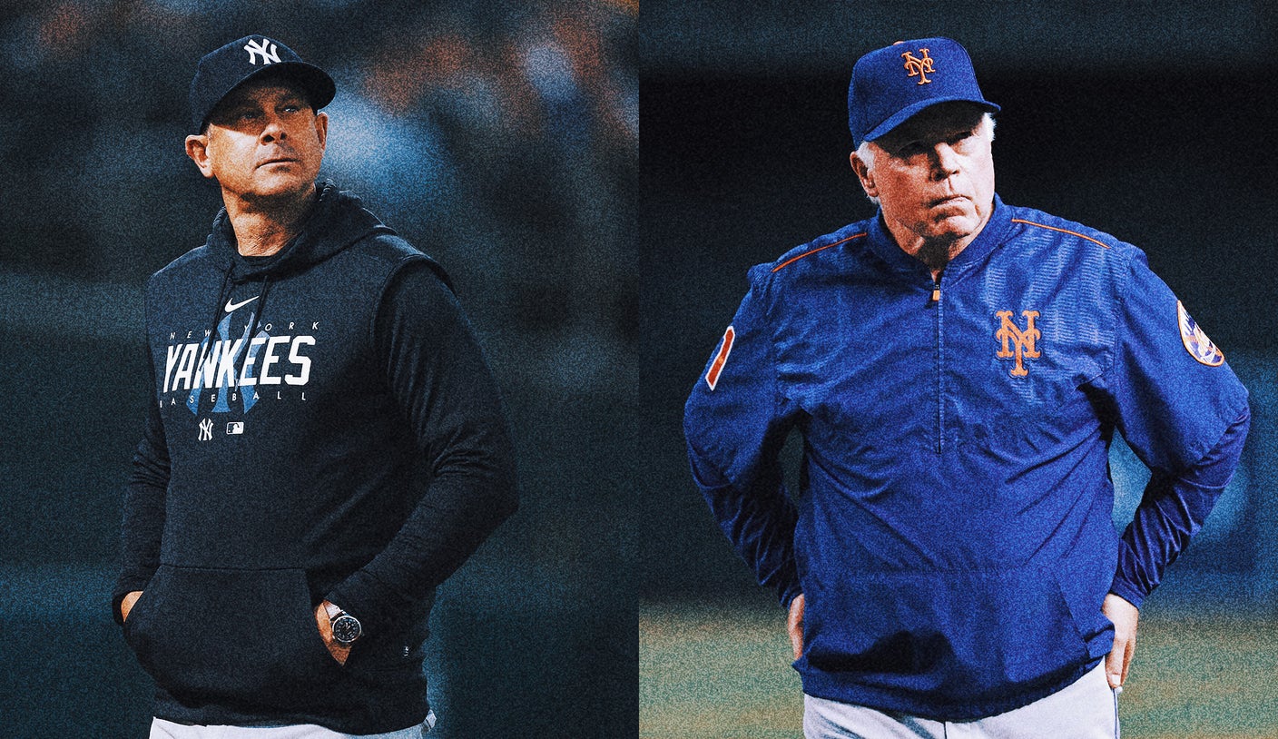 New York Yankees Derek Jeter stands next to New York Mets Jose