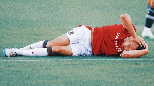 WREXHAM Trending Image: Wrexham striker Paul Mullin injured in collision with Manchester United goalie Nathan Bishop