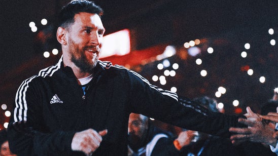 Lionel Messi takes pictures with fans while shopping at Miami supermarket