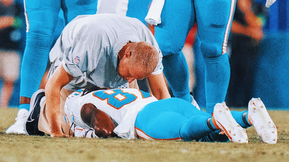 Daewood Davis of Dolphins carted off field after collision