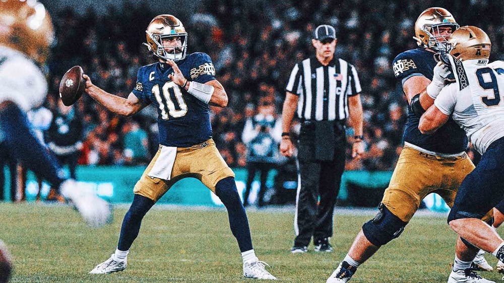 Hartman throws four TDs in No. 13 Notre Dame's 42-3 win over Navy in Dublin