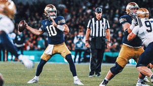 NEXT Trending Image: Hartman throws four TDs in No. 13 Notre Dame's 42-3 win over Navy in Dublin