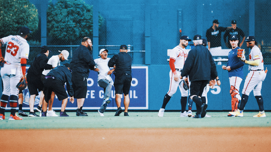 Braves' Ronald Acuña Jr. fends off fans in bizarre scene at Coors Field